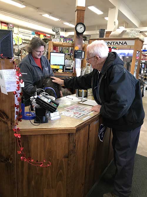 Helping Beth, the manager at The Red Lion Mill, with a customer.