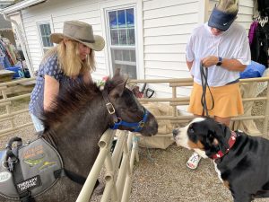 Dominique Making Friends with Dogs at Devon Horse Show and County Fair